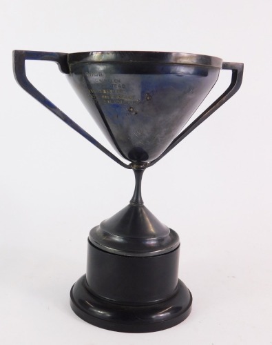 A George V silver trophy cup for Archibald Allen Memorial Cup, engraved with recipients from 1963, 1969, 1970 and 1972, on a black socle, Birmingham 1933, 8¼oz.