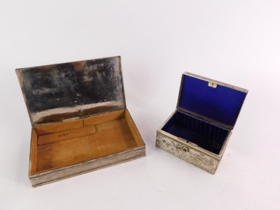 Two Eastern silver plated boxes, comprising a Chinese embossed and blue lined jewellery casket, and a Persian box, of rectangular section, engraved to the lid with arabesques, stamped 800. (2) - 2