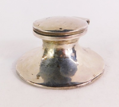 A George VI loaded silver capstan inkwell, of capstan form on a wooden base, London 1937, 4¼oz.