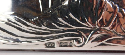 An Art Nouveau style silver photograph frame, the outer rim with embossed figures of females picking roses, maker's stamp PJP, Birmingham 1984, with a red velvet back, picture size 13cm x 8.5cm, frame size 25cm x 17.5cm. - 2