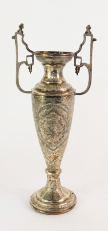 An Eastern twin handled vase, of baluster form, repousse decorated and engraved with birds and flowers, marks to neck, white metal, 12¾oz.