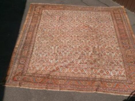 A red ground large Persian rug