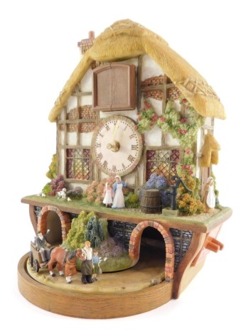 A Bradford Exchange Country Days cuckoo clock, 28cm high.