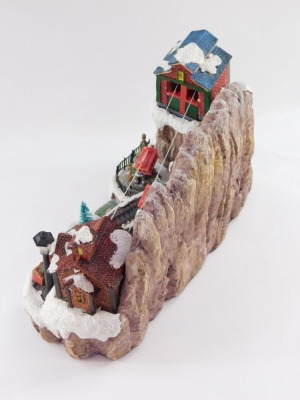 A Christmas musical figure group, on a plastic moulded base, with train and cart figures, 22cm high, 30cm wide. - 3