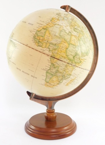 A late 20thC terrestrial globe, on a cream ground, with axle points, on a modern coppered effect frame and wooden basef, 40cm high.