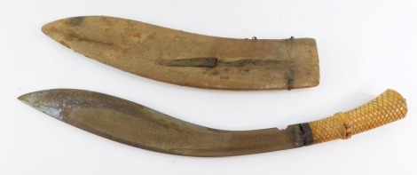 A late 19thC kukri, with curved blade and hatch design ivory handle, wooden scabbard, 48cm long.