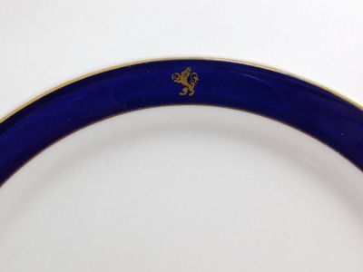 A group of Porsgrund Regal Norwegian dinner wares, to include cup and saucer, coffee can, side plates, ash tray, dinner plates, etc., each with a royal blue outer border and applied gilt emblem of a lion. (10) - 2