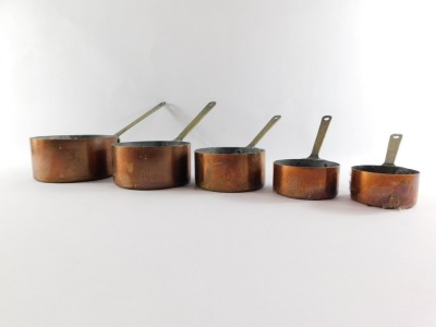 A set of five 19thC graduated copper saucepans, each with brass handles, the largest 16cm diameter, the smallest 7cm diameter. - 2