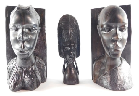 Tribal Art. A pair of carved wooden bookends, 30cm high, together with a tribal figure of bust with large headdress, 24cm high. (3)