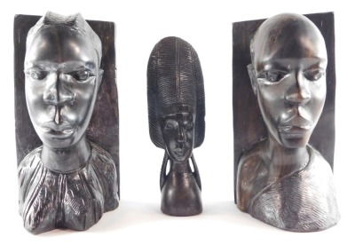 Tribal Art. A pair of carved wooden bookends, 30cm high, together with a tribal figure of bust with large headdress, 24cm high. (3)