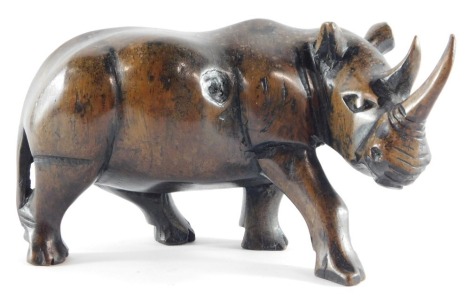 An African carved hardwood figure of a rhinocerous, 19cm wide.