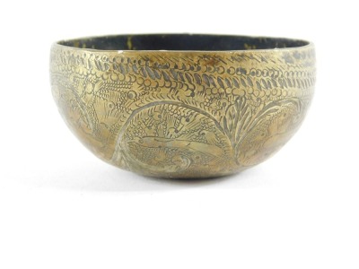 An Indian brass bowl, engraved with scrolls and birds, 9cm diameter. - 2