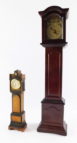 Two miniature grandfather clocks, comprising Kibley Craft grandfather clock, 22cm high, and another mahogany finish example, 42cm high.