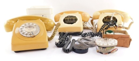 A group of vintage telephones, casing, dials, accessories, all AF. (1 box)