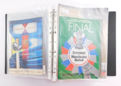 An album of football programmes from the 80s, including Arsenal V West Ham 10th May 1980, The Final Tie Manchester City V Tottenham Hotspur 9th May 1981, Brighton and Hove Albion V Manchester United 26th May 1983, 1976 Cup Final, Official Review Guide of