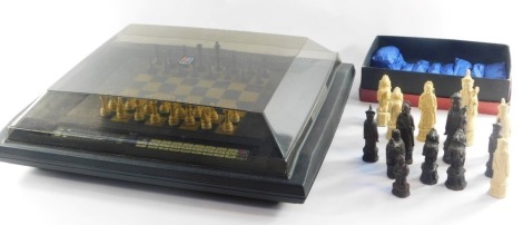 A Phantom Electronic MB Games chess board, set of resin chess figures and a set of resin Chinese chess figures. (a quantity)