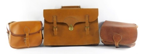 Three leather satchels, to include a leather laptop satchel and two ladies handbags, each in tanned leather. (3)