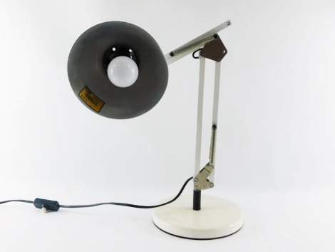 A German Contrast white anglepoise type table lamp, with two extensions, on circular base, approximately 35cm high without extension.