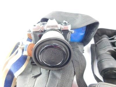 A group of camera and binocular equipment, comprising an Olympus OM10, Lokina SD 1-4-5.6 lens, Praticka travel binoculars, a Zennox 8:4 x50 binoculars, Zenith and other binoculars, boxed cameras, etc. (1 box) - 3