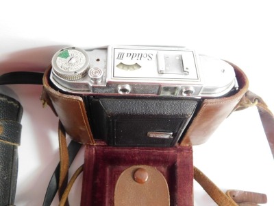 A group of camera and binocular equipment, comprising an Olympus OM10, Lokina SD 1-4-5.6 lens, Praticka travel binoculars, a Zennox 8:4 x50 binoculars, Zenith and other binoculars, boxed cameras, etc. (1 box) - 4