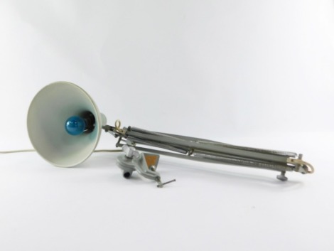 A clamp mounted grey angle poise type lamp, by the Thousand & One Lamps Ltd, 115cm high.