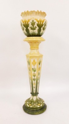 An Art Nouveau pottert jardiniere and stand, with green and yellow floral flared rim bowl, with leaf detailing, stamped LAP Leeds, England, 306B, on a matching hexagonal stemmed circular foot base, 112cm high overall. - 2