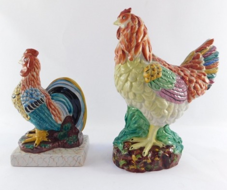 Two Chinese pottery cockerel figures, comprising one on a white painted base, possibly French, 25cm high, and another standing with glazed finish on rock, 31cm high.