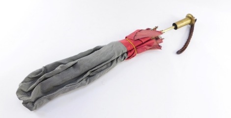 A 1920's/30's Growy parasol, with brass ends and collar, and red material detailing, 55cm long.
