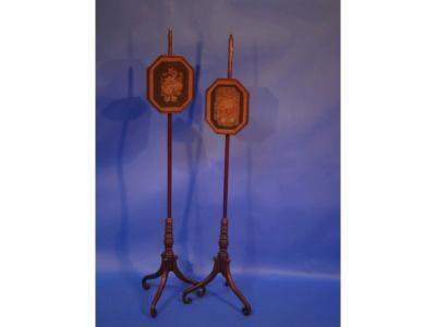 A pair of Regency mahogany pole screens