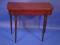 A George III mahogany card table with fold over top