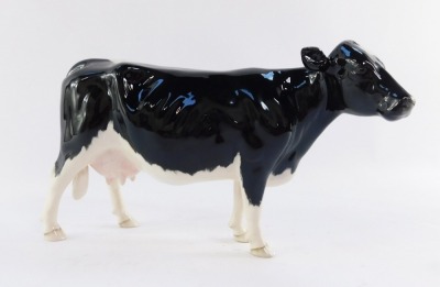 A Beswick Shetland cow, model 4112, 13cm high. - 2