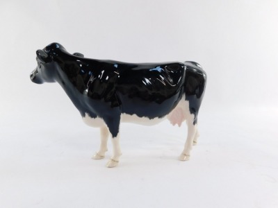 A Beswick Shetland cow, model 4112, 13cm high. - 3