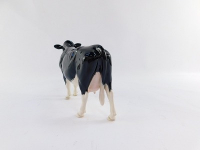 A Beswick Shetland cow, model 4112, 13cm high. - 4
