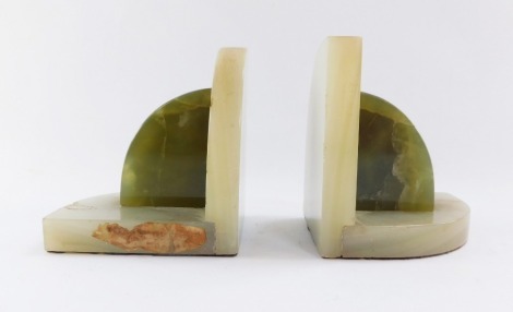 A pair of green onyx bi-coloured bookends, 14cm high.