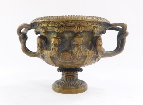 A French late 19thC Warwick type bronze vase, after Barbedienne, cast with Bacchanalian masks, 10cm high.