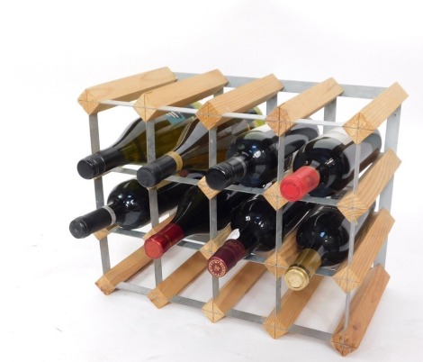 A wine rack and contents of nine bottle of various wine, comprising The Chenin Blanc Zebra View, Hardys Crest Dessert wine, a Reservoir ESpecial Cabernet Sauvignon, a Chateau Roc De Boisseaux, Atlas Tamaron, Giordano, a Blandy's Duke of Clarence red and a