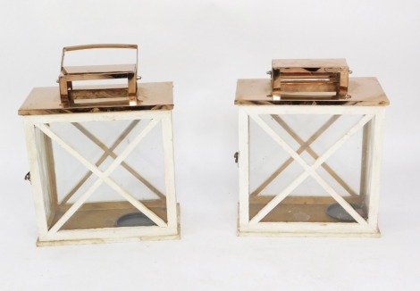 A pair of 1930's white painted and copper lidded lanterns, 39cm high, 30cm wide, 16cm deep.