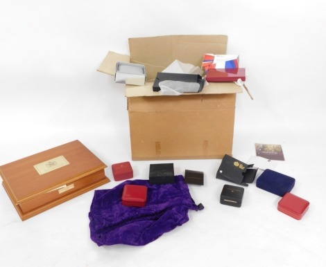 A group of empty coin presentation boxes and certificates. (1 box)