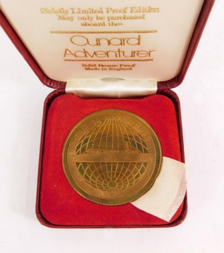 A Cunard Adventurer limited proof edition bronze coin, boxed.