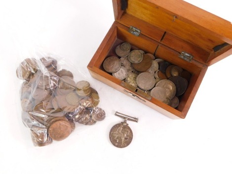 A wooden storage box and contents of coins and medals, to include half pennies, three pences, various two shillings and a 1914-18 medal inscribed 33401 PTE R Stanwell North D Fus.