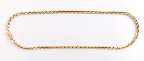A double S link neck chain, on a snap clasp, clasp only marked 9kt, 41cm long.