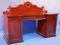 A Victorian mahogany twin pedestal sideboard with applied scrolled back