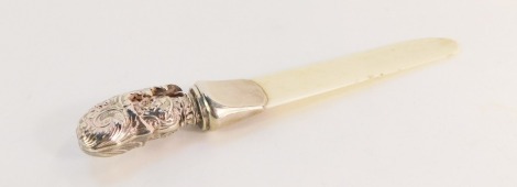 A Victorian silver handled and ivory letter opener, the high relief silver top with rococo scroll and flower detailing, Sampson Mordan & Co, London 1898, 18cm long.