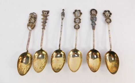 Six Chinese silver spoons, each with bamboo effect shaft and differing terminals, to include buildings, Chinese figures, dragons, and characters, maker's stamp Wing Nam & Co, Hong Kong, 2½oz.