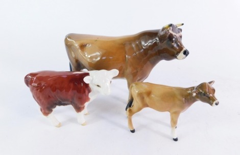 A group of Beswick cows, comprising a Jersey C H Dunsley Coy Boy bull, Jersey calf and a Hereford calf, 12cm, 7cm and 8cm high. (3)