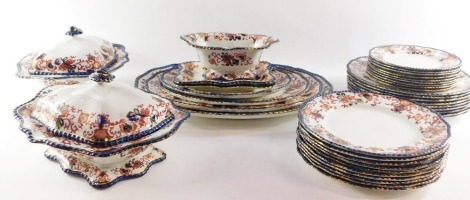 A Doulton Burslem pottery Nankin pattern part dinner service, including two tureens and covers, dinner plates, side plates, comport, graduated meat plates, etc. (a quantity)