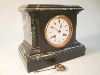 A late 19thC slate and marble mantel clock