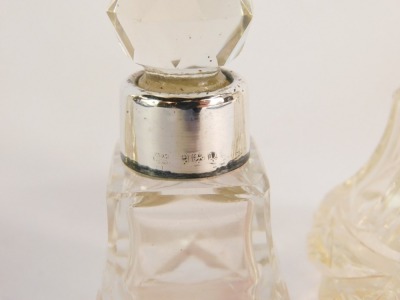 A pair of cut glass scent bottles and stoppers, with silver mounts, and a further scent bottle and stopper, with silver mount, hallmarks worn. (3) - 2