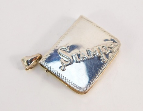 A silver stamp case, of book form, embossed 'Stamps' with plain back, ring chain attachment, stamped 925, 3.5cm wide.
