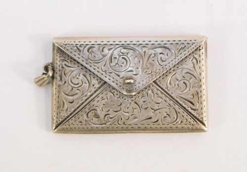 A silver stamp case, of twin division envelope form, with engraved foliate scroll decoration, ring chain attachment, stamped sterling silver, 9.4g.